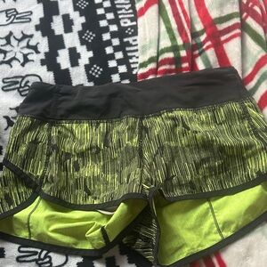Lululemon Athletica Black and Green Athletic Shorts with Two-Layer Design